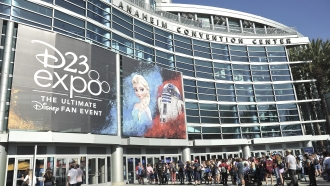 People line up in front of the Anaheim Convention Center during the 2019 D23 Expo.