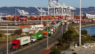 Trucks line up to enter a Port of Oakland shipping terminal on Nov. 10, 2021, in Oakland