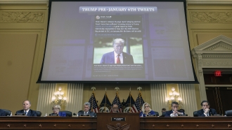 A tweet from then-President Donald Trump is displayed at a House select committee meeting.
