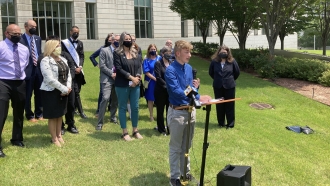 Dylan Brandt speaks at a news conference outside the federal courthouse in Little Rock, Arkansas