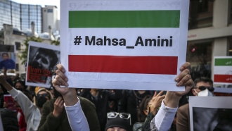 Iranian women gather to protest over the death of Mahsa Amini during a demonstration