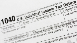 A portion of the 1040 U.S. Individual Income Tax Return form is shown.