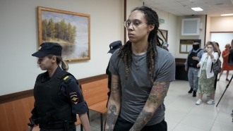 WNBA star Brittney Griner is escorted out of court in Russia