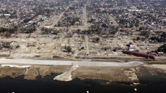 Repairs continue on a large section where the levee broke during Hurricane Katrina.