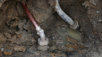 a copper water supply line is shown connected to a water main in Flint, Michigan