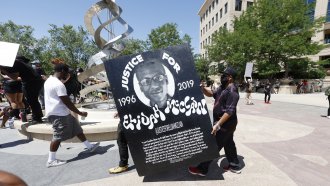 Demonstrators march after the death of 23-year-old Elijah McClain