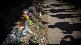Visitors see a memorial to the victims of the Astroworld concert.