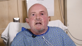 In this image from video provided UCHealth Memorial Hospital Central, Club Q shooting survivor Ed Sanders talks