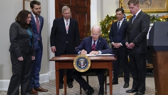 President Joe Biden signs H.J.Res.100, a bill that aims to avert a freight rail strike.