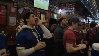 USA fan booing while watching the match.
