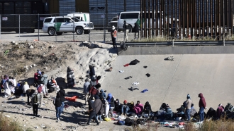 Migrants wait to cross the U.S.-Mexico border from Ciudad Juárez, Mexico.