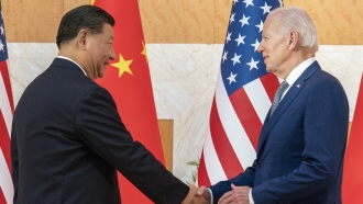 U.S. President Joe Biden, right, and Chinese President Xi Jinping shake hands