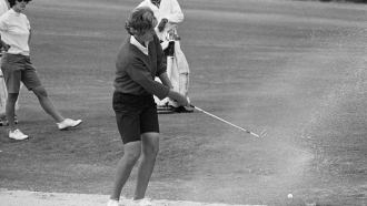 Kathy Whitworth swings a golf club in 1966