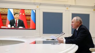 Russian President Vladimir Putin speaks during a meeting with Chinese President Xi Jinping via a video confer