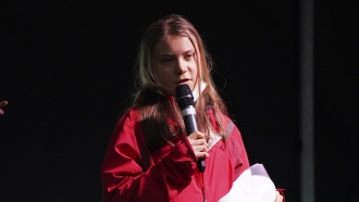 Swedish climate activist Greta Thunberg speaks on the stage of a demonstration in Glasgow, Scotland