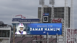 A scoreboard at Great American Ballpark displays a photo of Buffalo Bills' Damar Hamlin.