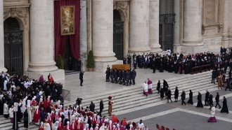 The coffin of late Pope Emeritus Benedict XVI is carried away after a funeral mass in St. Peter's Square at the Vatican