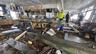 A support beam is seen inside a storm damaged California restaurant.