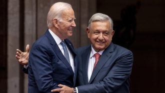 President Joe Biden is greeted by Mexican President Andres Manuel Lopez Obrador as he arrives at the National Palace