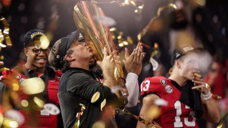 Georgia head coach Kirby Smart kisses the trophy after the national championship NCAA College Football Playoff game.
