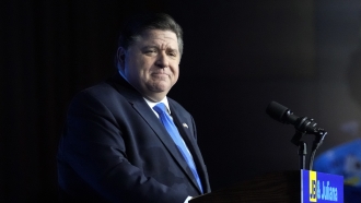 Illinois Gov. J.B. Pritzker looks to supporters after he defeated GOP challenger Darren Bailey