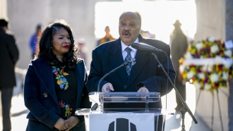 Martin Luther King III, center, the son of Martin Luther King Jr., accompanied by his wife Arndrea Waters King
