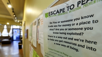 A poster notes resources for victims of human trafficking.