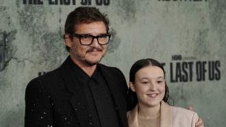 Pedro Pascal and Bella Ramsey, cast members in "The Last of Us," pose at the show's premiere.