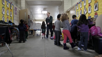 Kindergarten students at Crestmoor Elementary School, get ready for a recess break