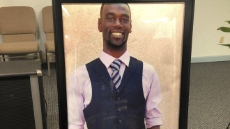 A portrait of Tyre Nichols is displayed at a memorial service for him.