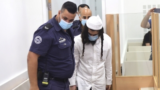 Israeli Jewish extremist Amiram Ben-Uliel arrives in court.