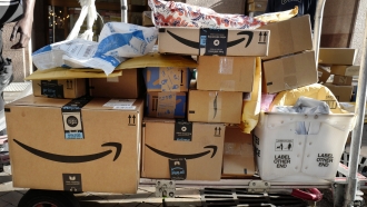 Amazon Prime boxes are loaded on a cart for delivery in New York.