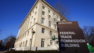 The Federal Trade Commission building is shown.