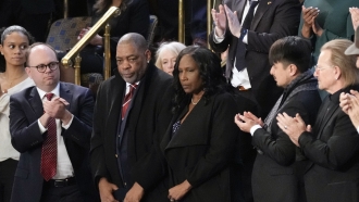 RowVaughn Wells and her husband Rodney attend the State of the Union address
