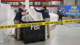 FBI special agents assigned to the evidence response team process material recovered from the high altitude balloon.