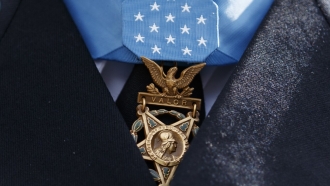 The Medal of Honor is seen around the neck of Medal of Honor recipient Army Staff Sgt. David Bellavia.