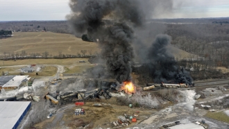 Portions of a Norfolk Southern freight train that derailed in East Palestine, Ohio, are on fire.