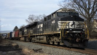 A Norfolk Southern freight train passes passes through East Palestine, Ohio, on Thursday, Feb. 9, 2023
