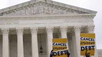 Student debt relief activists gather outside the U.S. Supreme Court.
