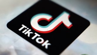 The TikTok logo seen on a cellphone.