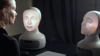 Robots speaking to a person.