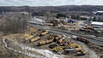 A view of the scene Feb. 24, 2023, as the cleanup continues at the site of of a Norfolk Southern freight train derailment.
