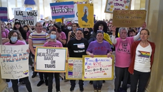 FILE - Trans-rights activists protest outside the House chamber at the Oklahoma state Capitol, Feb. 6, 2023