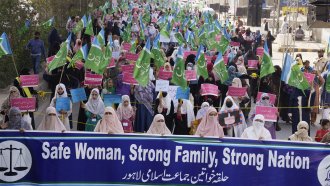 Women supporters of a religious party "Jamaat-e-Islami" participate in a rally to mark International Women's Day in Pakistan.