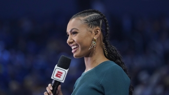 TV host Malika Andrews speaks during an NBA basketball game