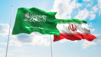 Iran and Saudi Arabia flags waving.