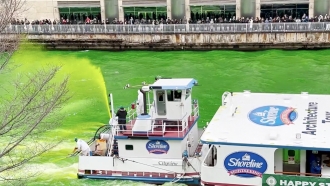 Chicago River being sprayed green.