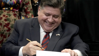 Illinois Gov. J.B. Pritzker signs into law the Paid Leave For All Workers Act.