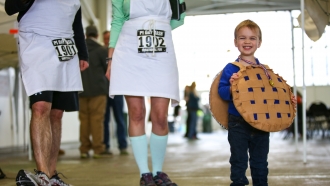 Malcolm Sutherland, 3, wears a pie costume during a Pi Day celebration.