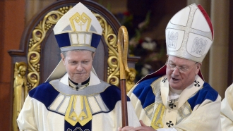 Newly ordained Bishop Edward B. Scharfenberger, left, and Cardinal Timothy Dolan.